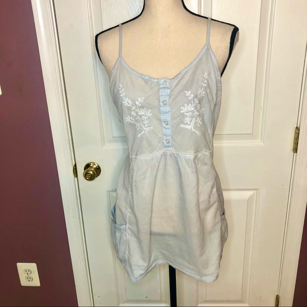 Blue and white striped sleeveless top